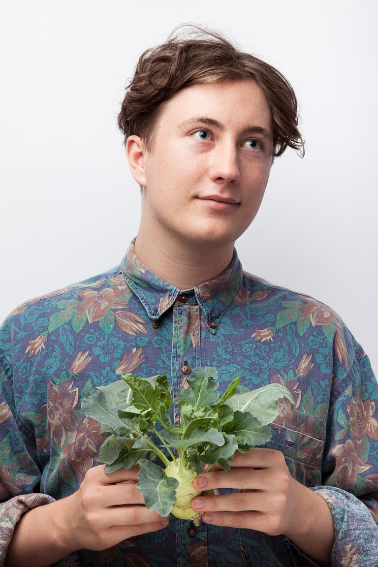 Musician Elliot photographed with a turnip.