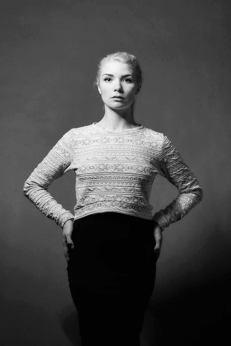 A woman with hands on her hips.