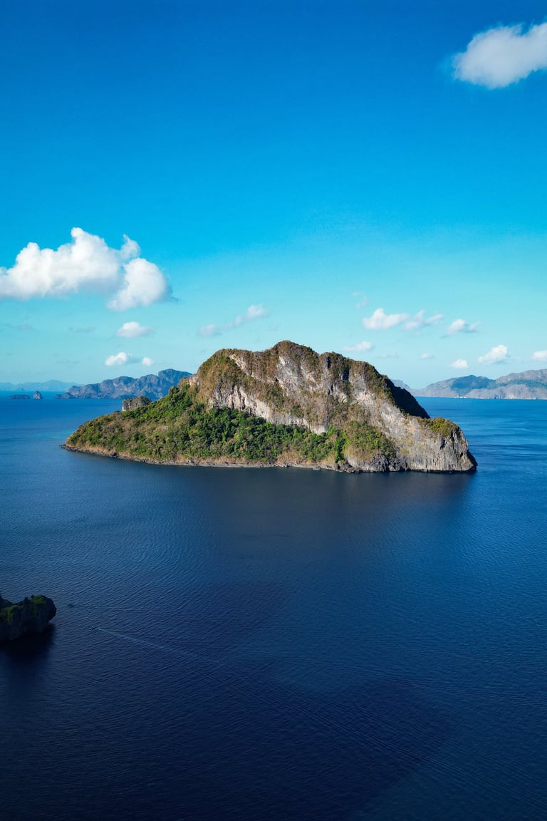 a small island with a small island in the middle of the ocean