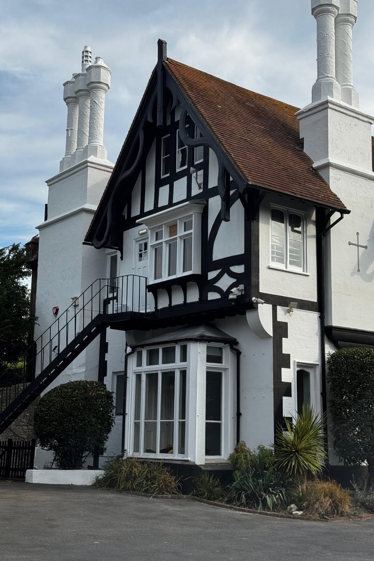 Church house exterior painting in Lancing Sussex, heritage black and white finish