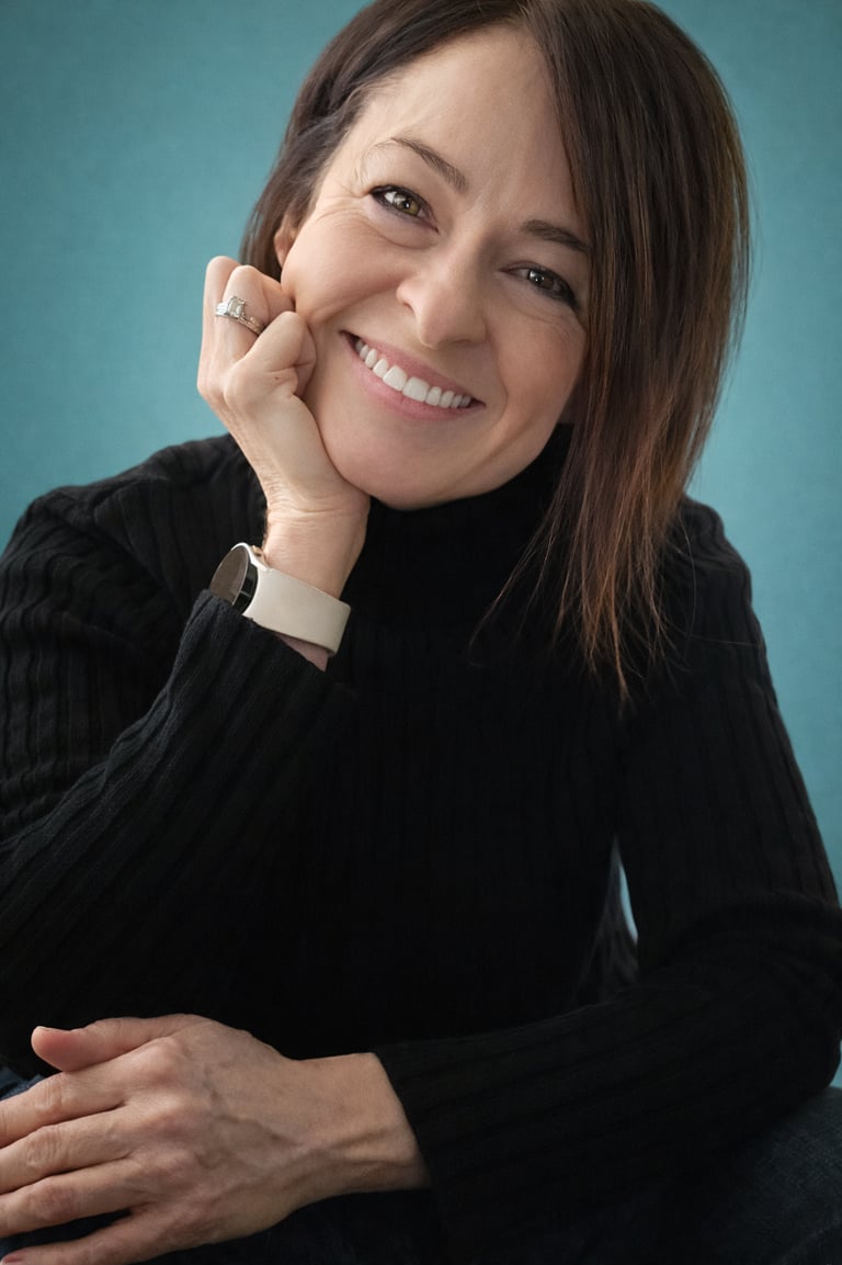 a woman with a black sweater and a white shirt