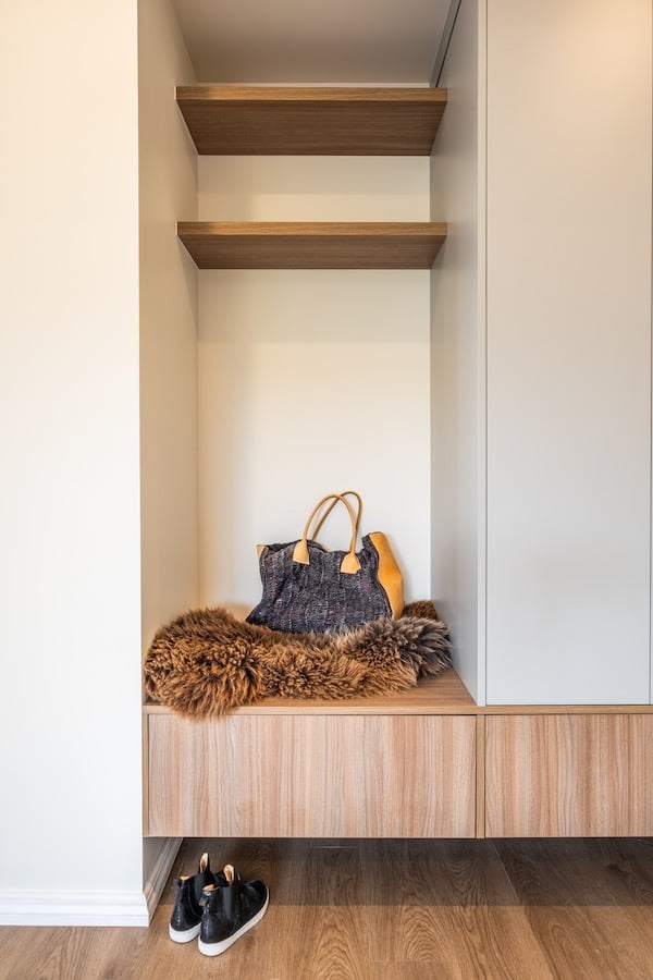 Custom cloak closet with built in seating