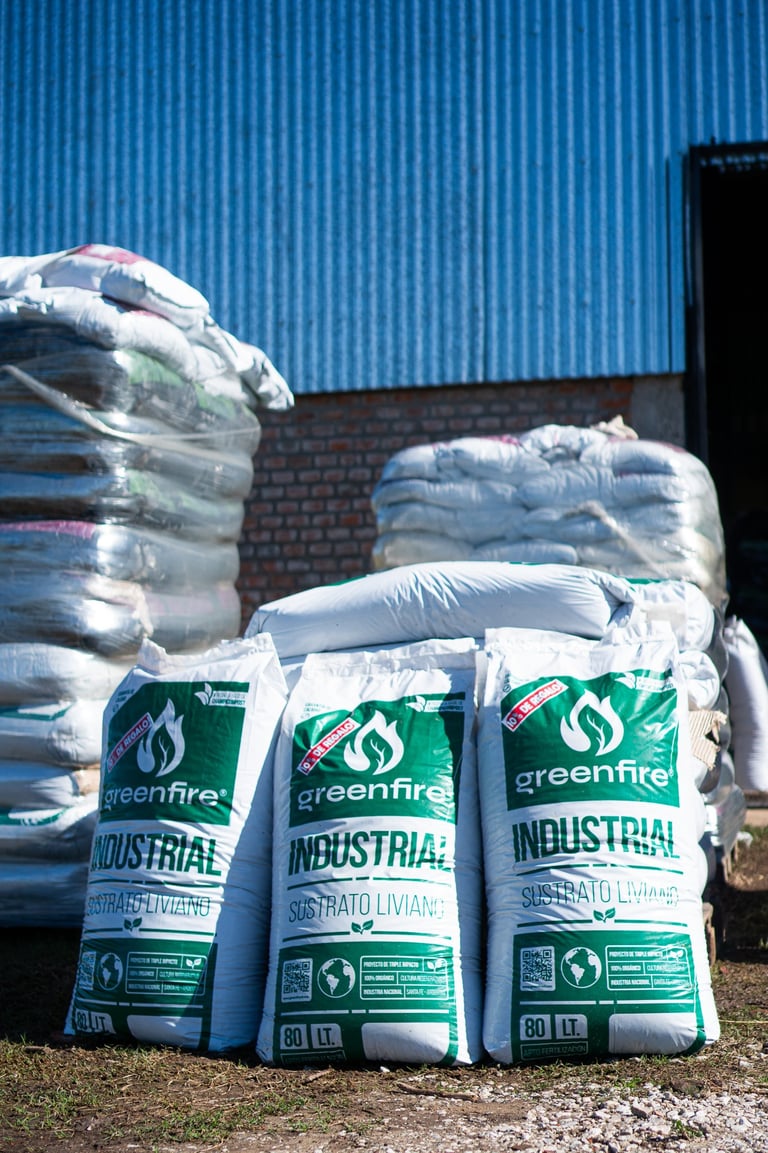 a pile of bags of cement in front of a building