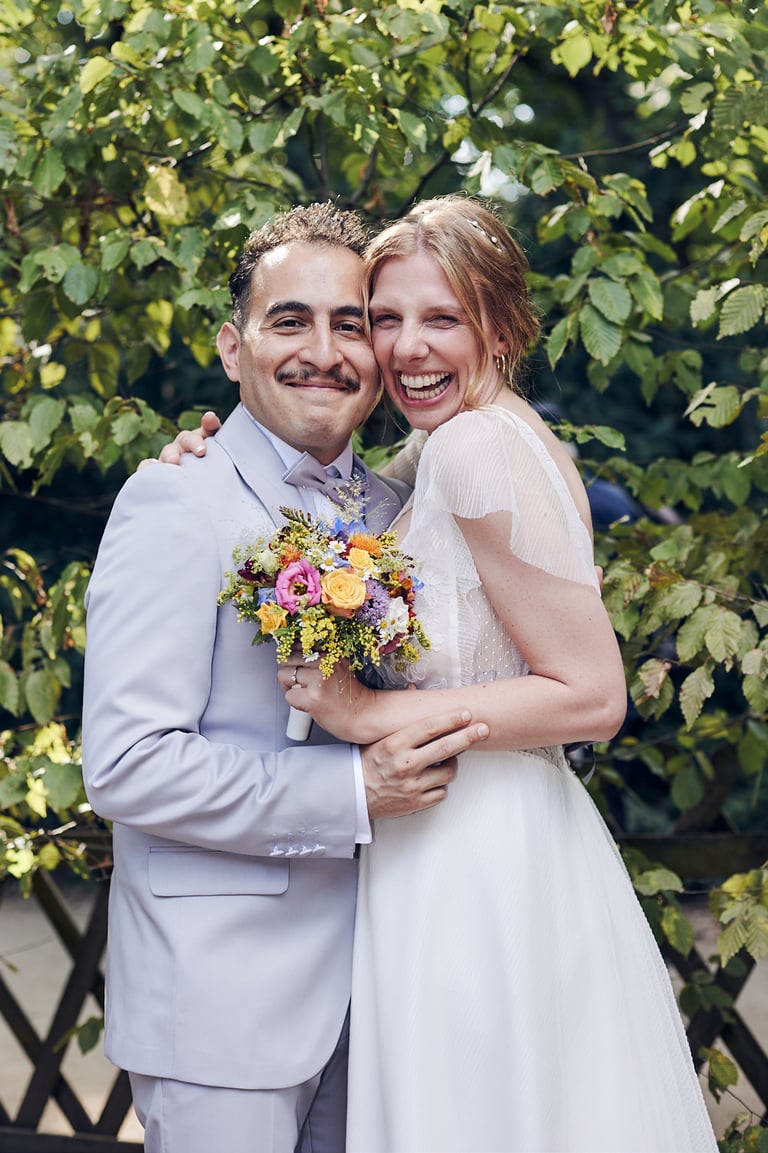 Newlyweds portrait in a park.