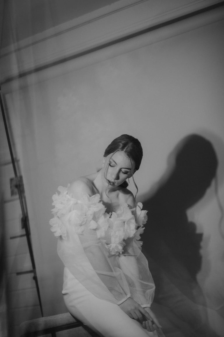 a woman in a white dress and a veil