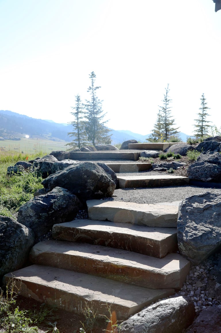a stone steps leading up to a stone stepstone