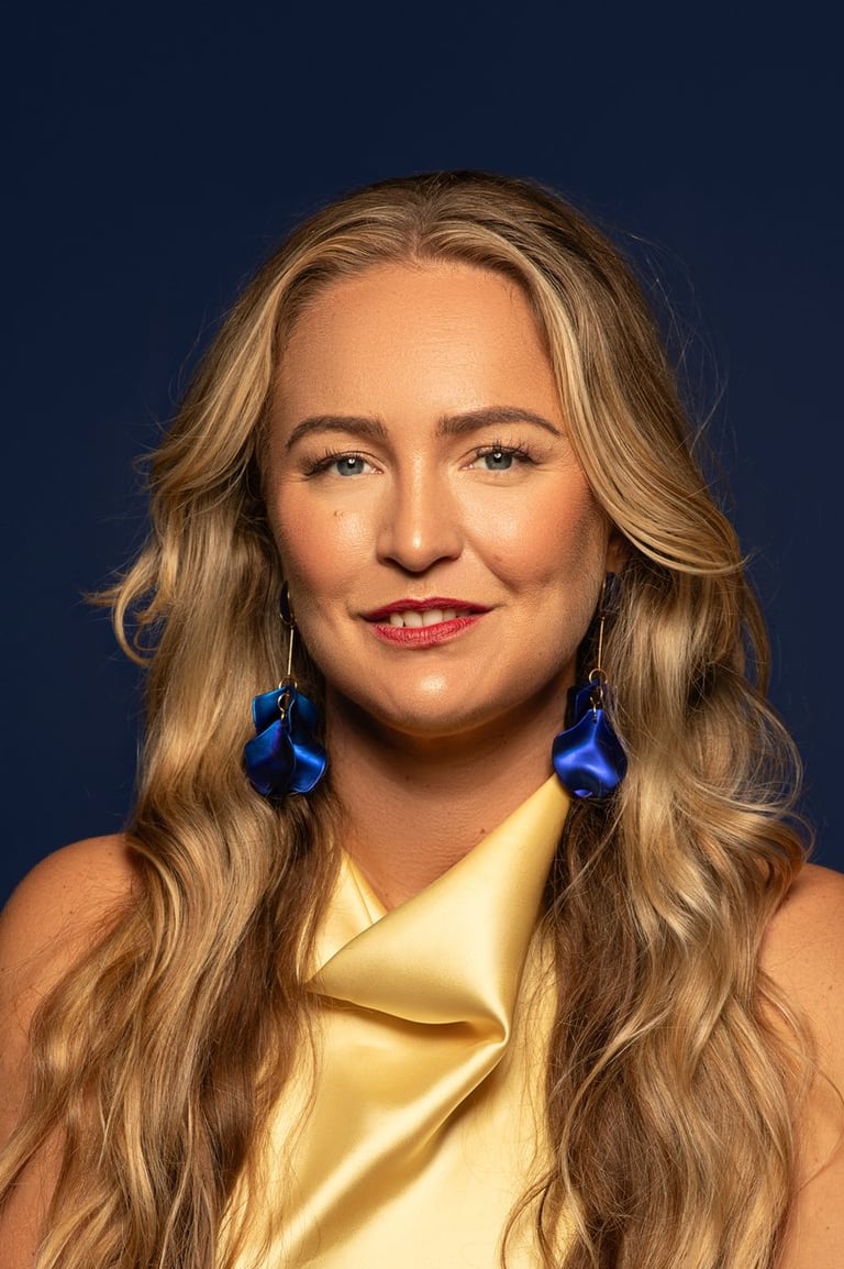 a woman with long blonde hair and blue earrings