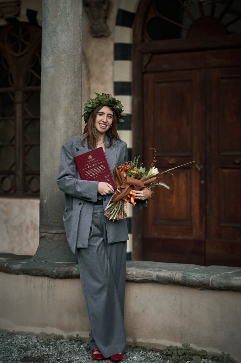a woman in a suit and a flower crown