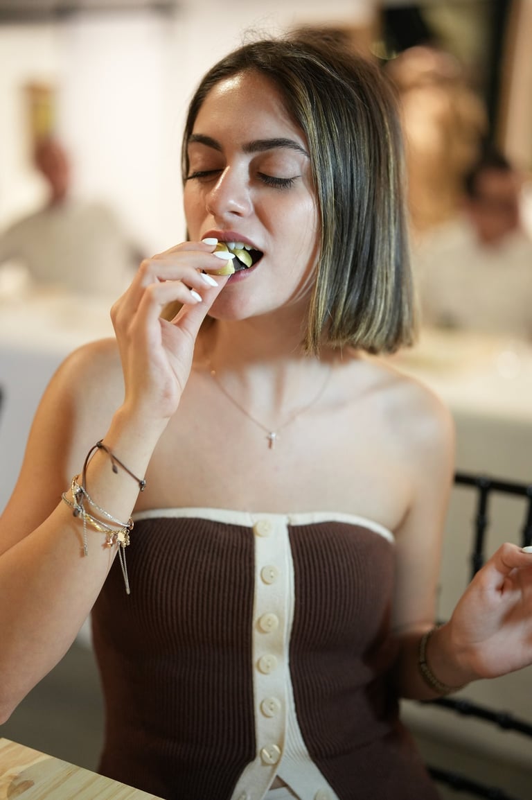 Guest enjoying artisan chocolate during a luxury chocolate tasting experience by DIBOC in Tampa