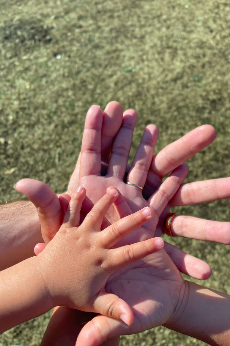A family holding hands together