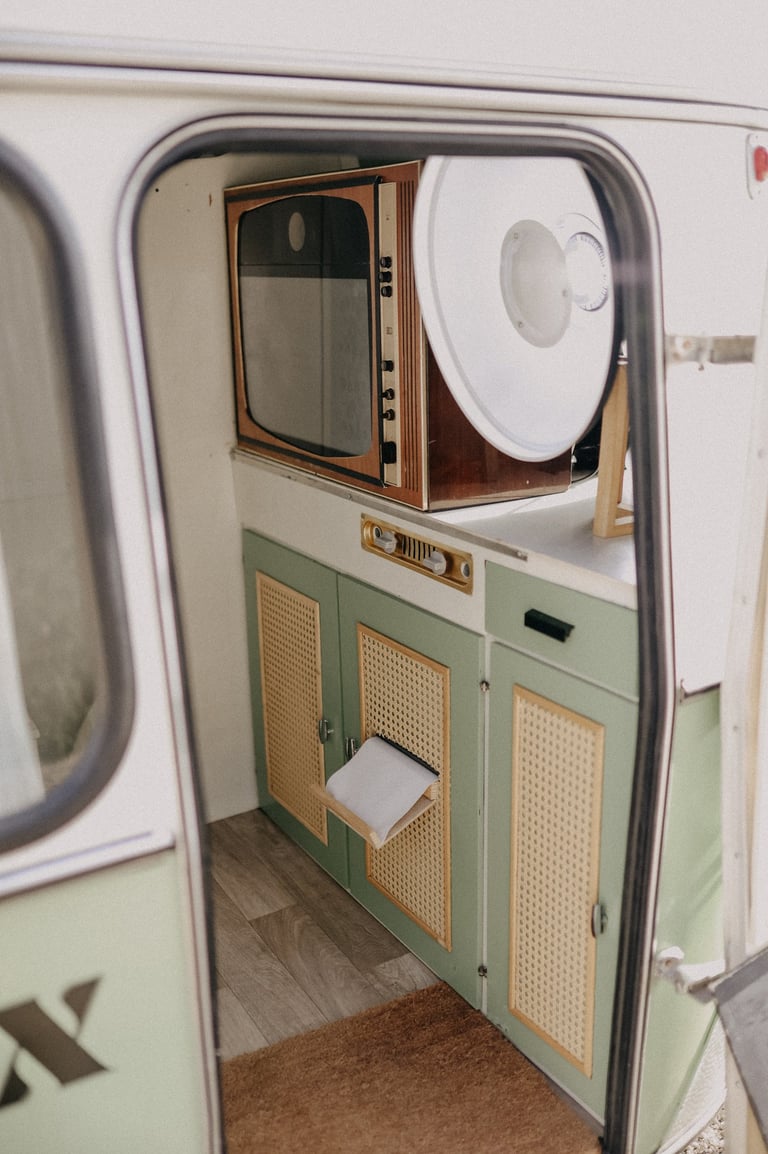 a small kitchen with a microwave and a microwave