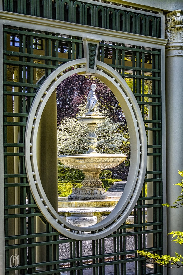 Photo of garden lattice framing a water fountain