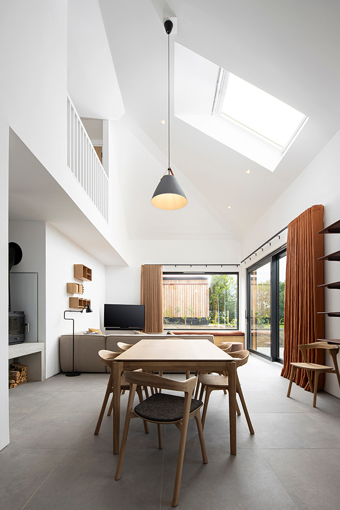 a dining room with a table and chairs