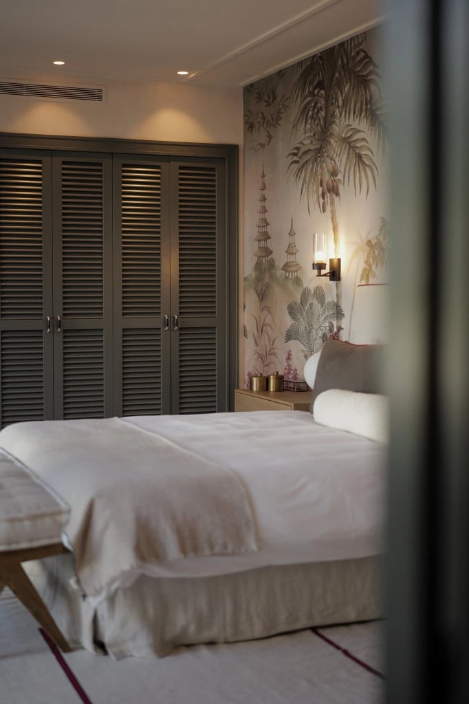 Bedroom at Villa La Gratitud with natural textures and warm lighting