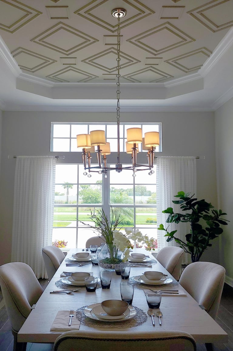 Dining room with gold chandelier lighting