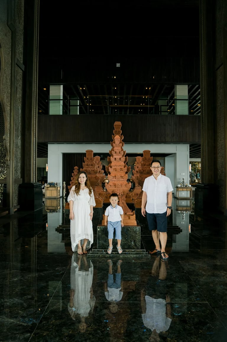 Family walking inside The Grand Lobby at The Apurva Kempinski Bali during a luxury family photography session in Nusa Dua