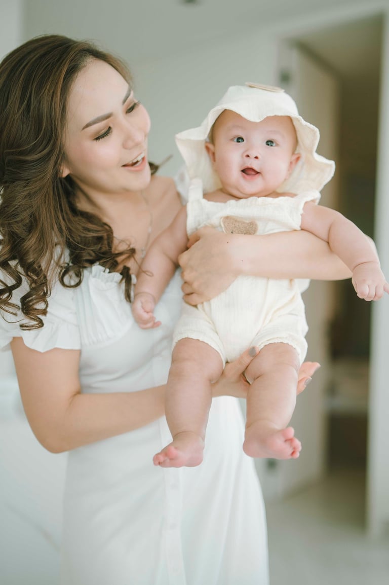 young family portrait inside Bali villa living room