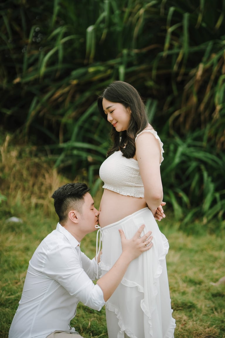 romantic beach maternity moment in Bali with natural light