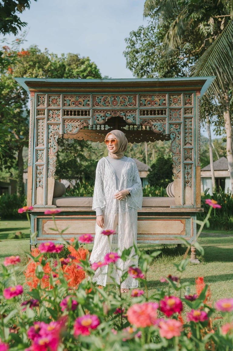 Portrait of woman standing near garden pavilion at Candi Beach Resort Karangasem Bali