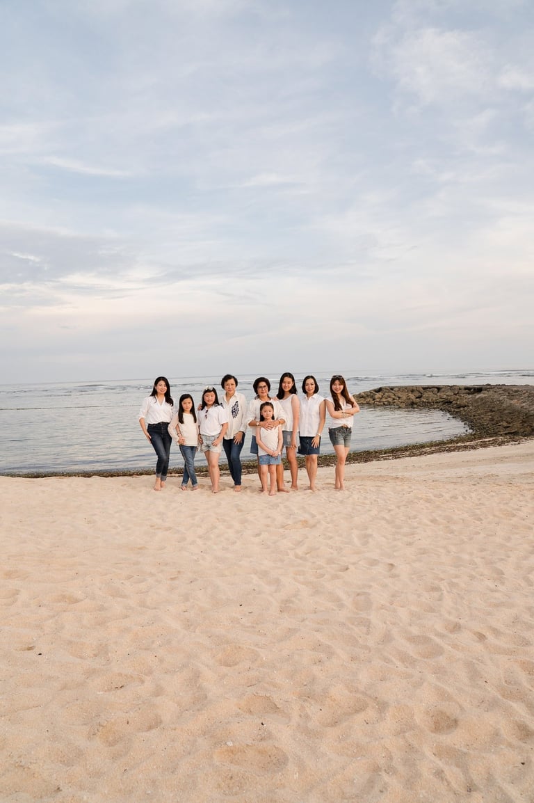 Extended family walking along the beach at The Ritz-Carlton Bali in Nusa Dua during a relaxed family photoshoot