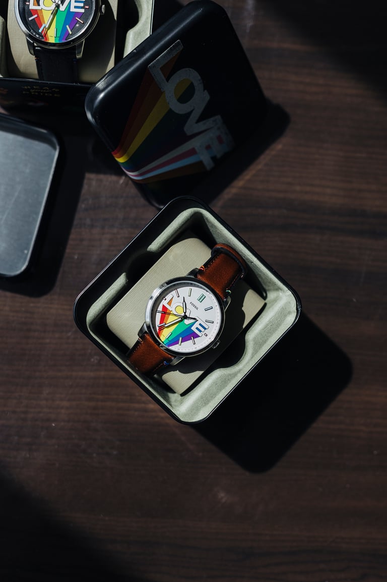 Two Fossil watches with the pride flag.