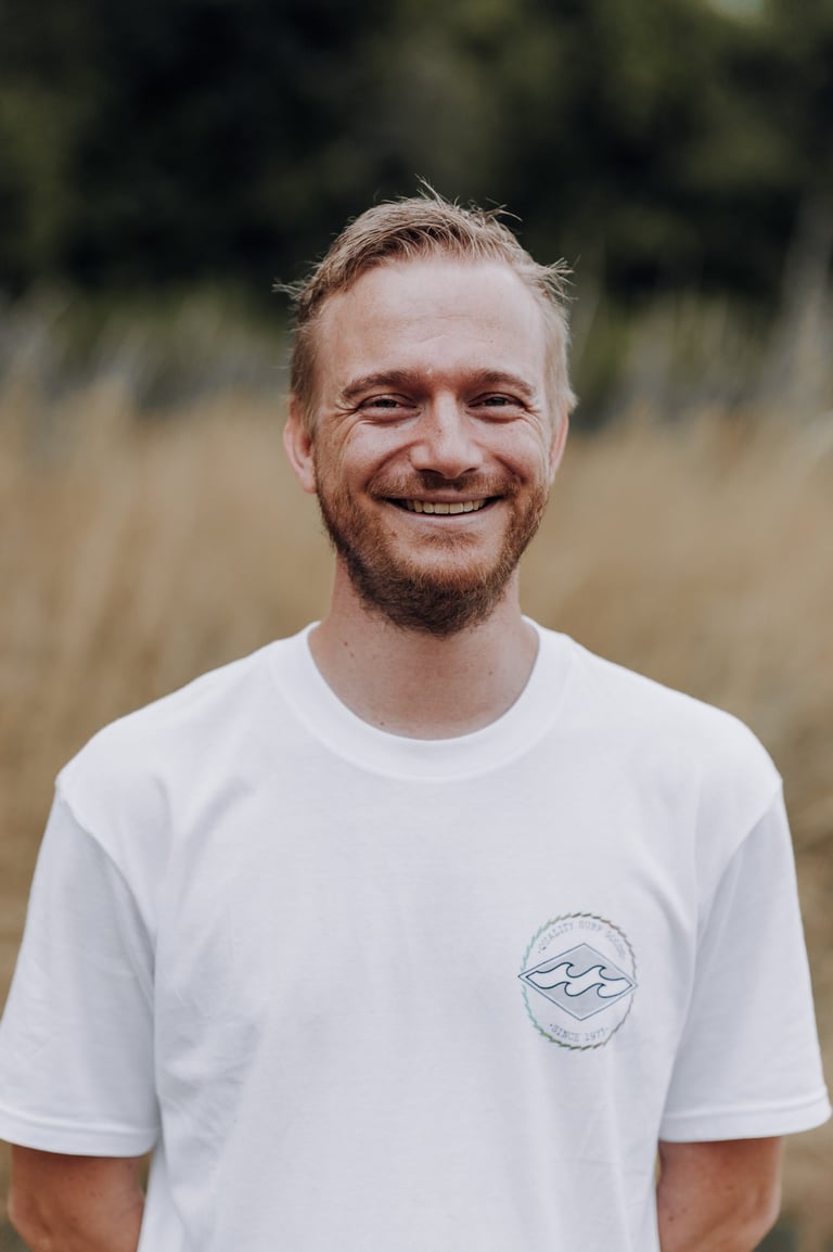 a man with a beard and a beard, smiling