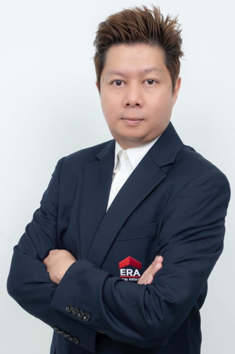 a man in a suit and tie with a red tie