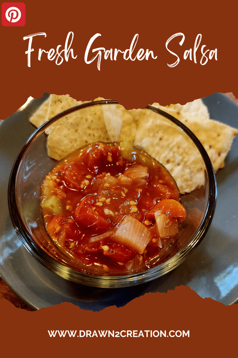 a bowl of fresh garden salsa with tortilla chips