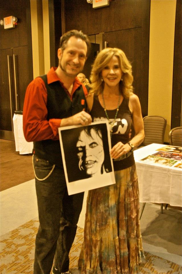 a man and woman holding a picture of a photo