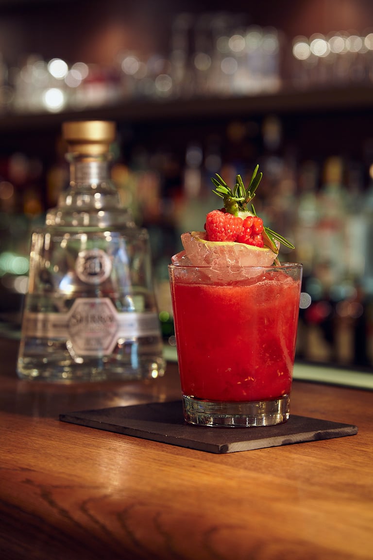 A raspberry and rosemary cocktail.