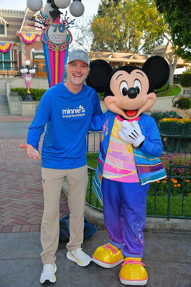 Chris Breedlove pictured with Mickey Mouse at Disneyland® Park.