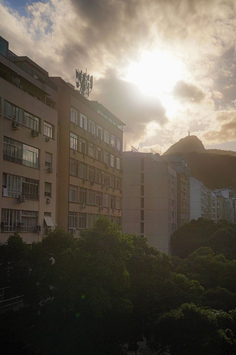 a city street scene with a clock tower in the background
