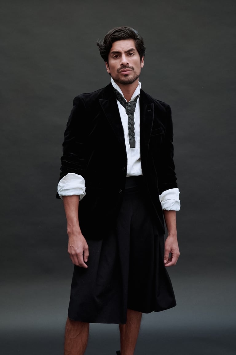 Dany Peña in formal black-and-white outfit