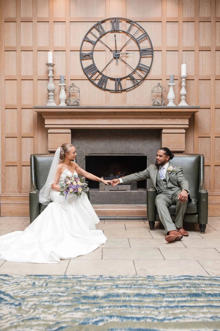 Newly weds hold hands in a beautiful wedding portrait