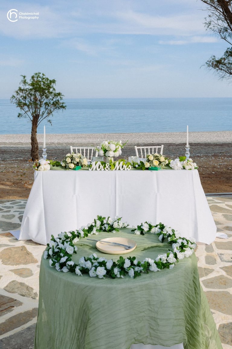 a wedding table with a wedding setting on beach