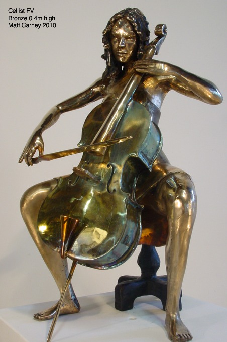 a statue of a woman playing the cello
