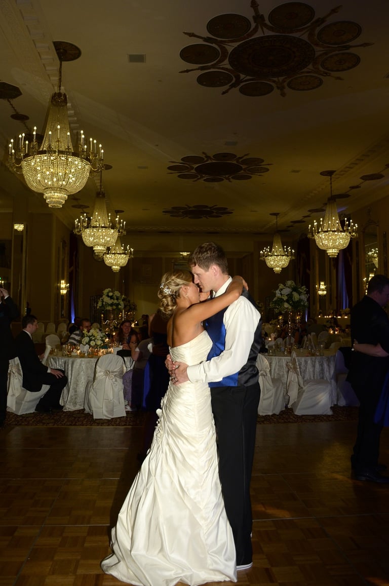 a bride and groom dancing at a wedding reception in a hotel