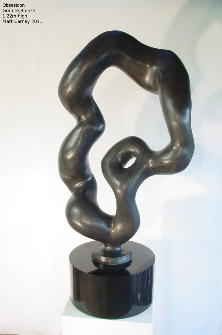 a patinated bronze abstract sculpture