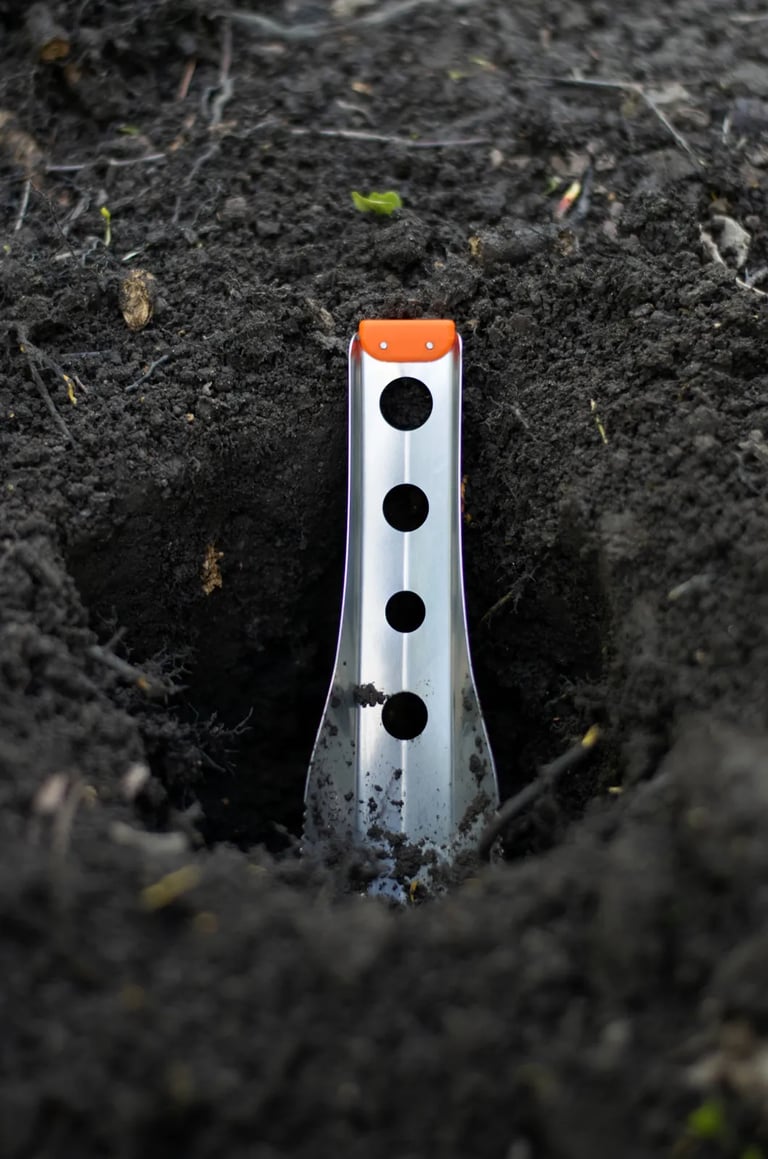 boglerco trowel in a cathole closeup
