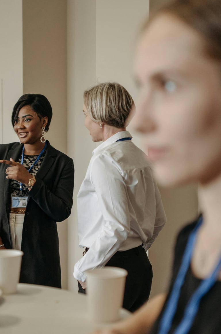 a woman in a black dress shirt and a man in a suit