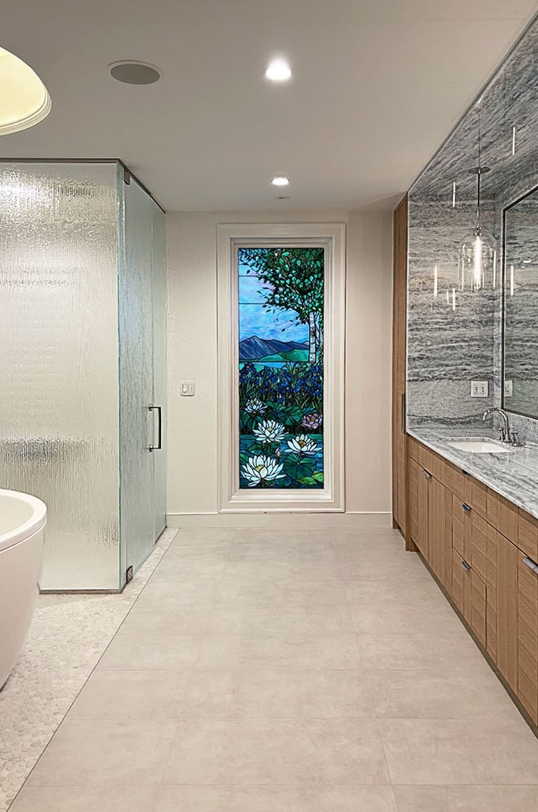 Renovated primary bath, freestanding tub, rain glass shower, stained glass window, Erica Fossati Lexington
