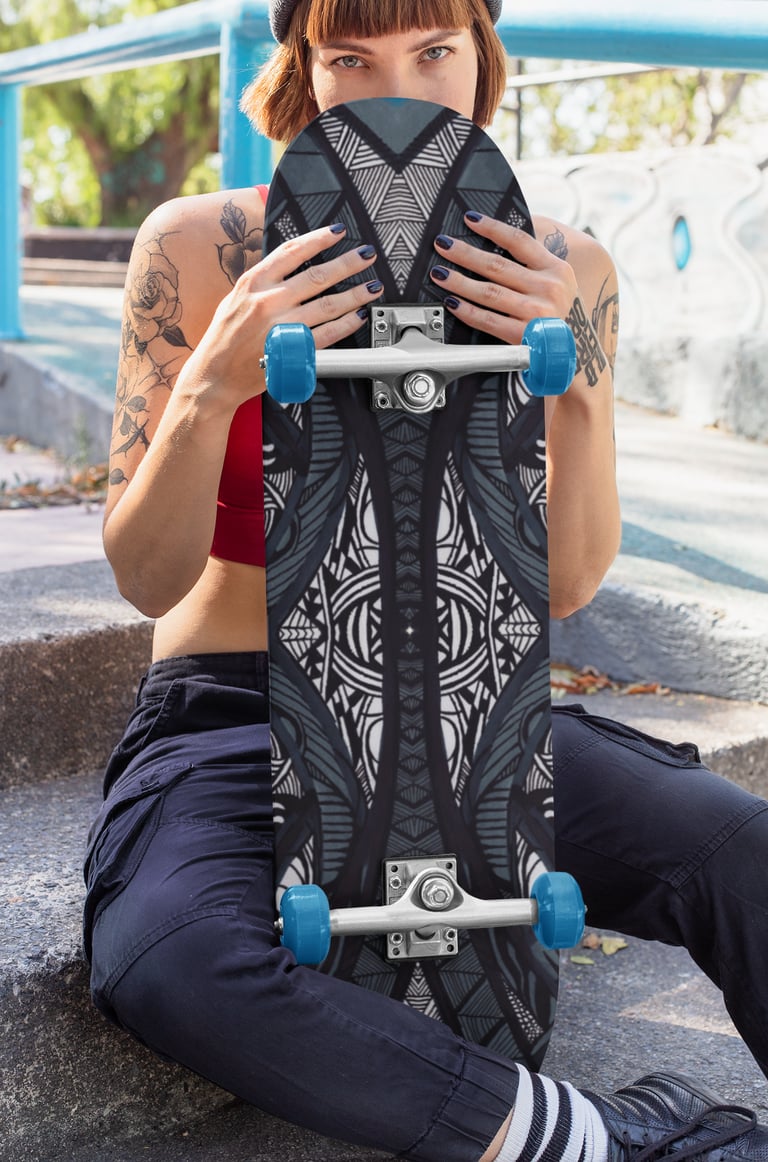 a woman sitting on steps with a skateboard
