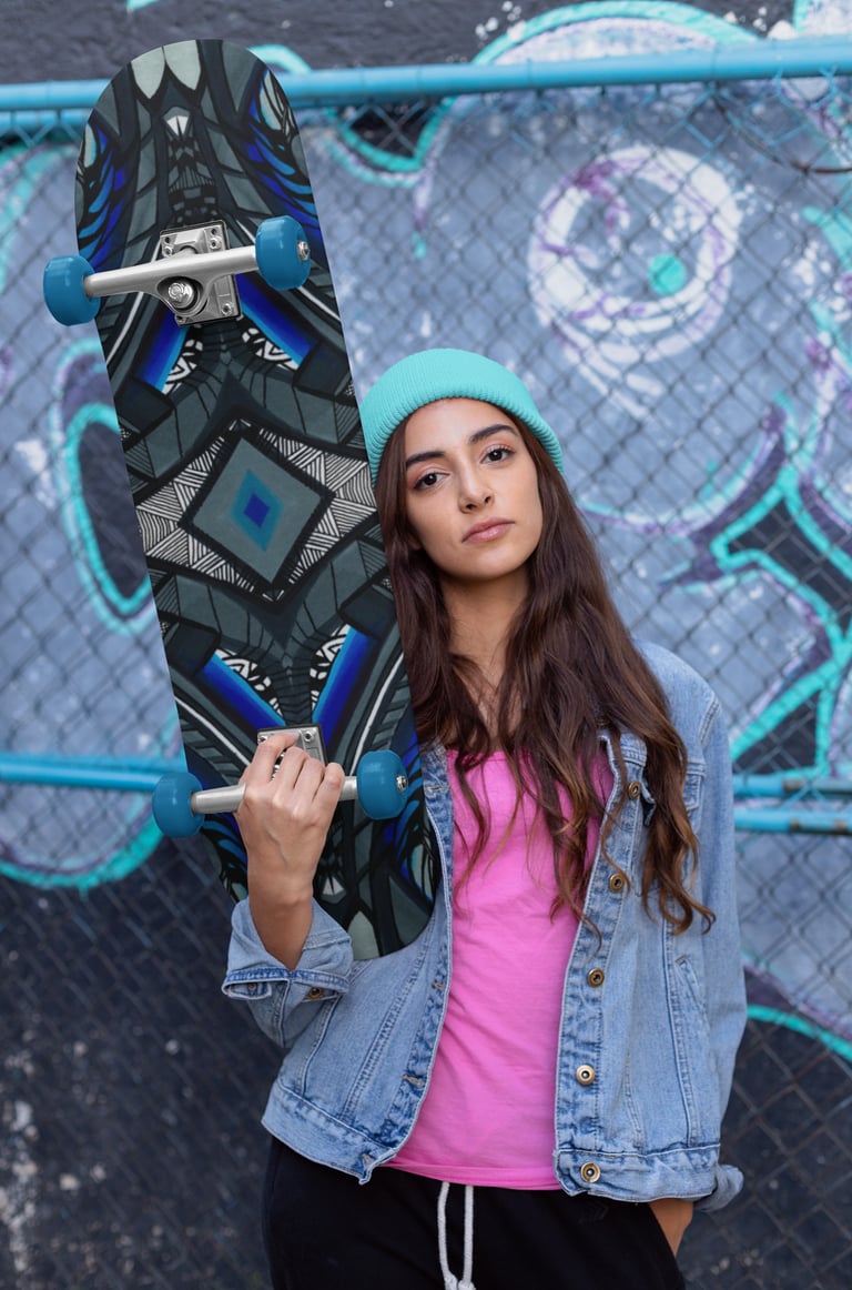 a woman in a pink shirt and jeans jacket holding a skateboard