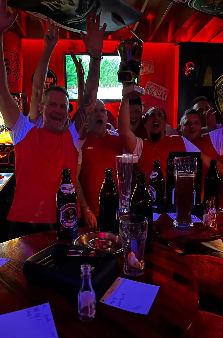a group of people standing around a bar