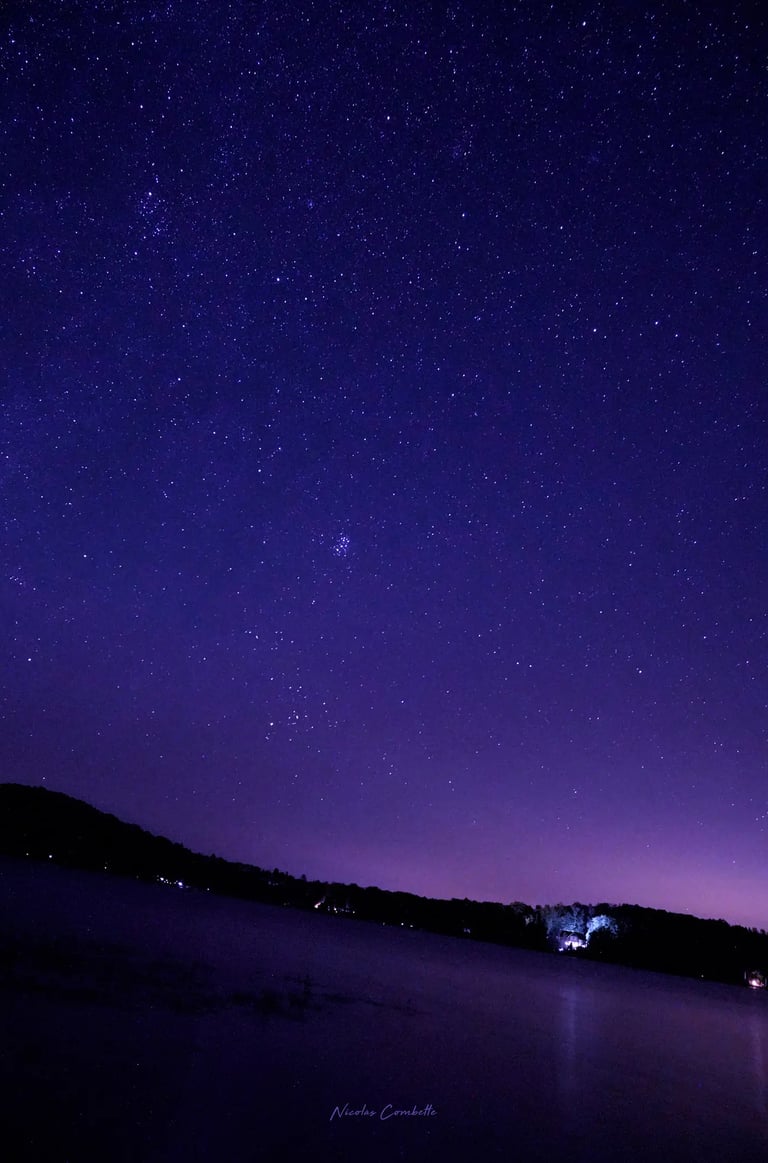 a boat is floating in the water at night