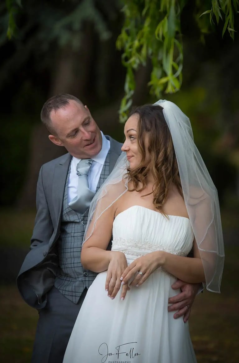 newly-weds having a walk around the grounds of Tudor Barn Eltham