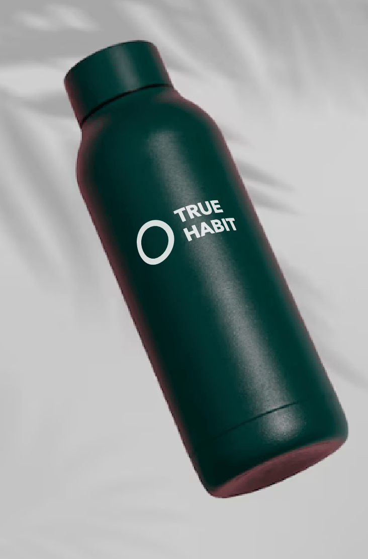 a bottle of Truehabit in a green bottle
