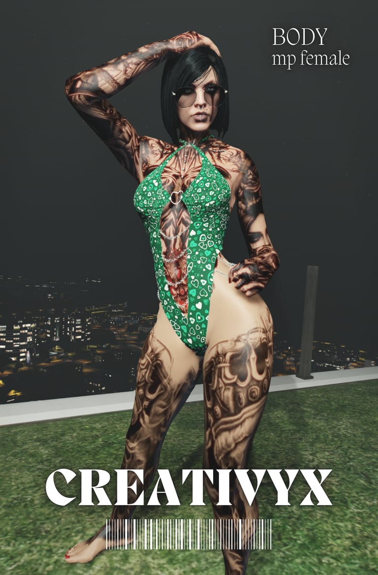 Tattooed woman with black hair posing in a green bodysuit