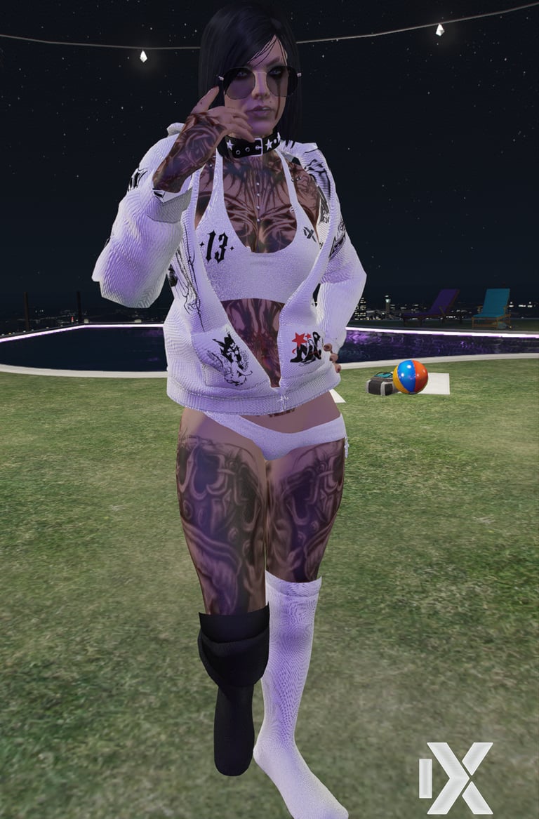 a woman with tattoos on her body and a tattoo on her chest