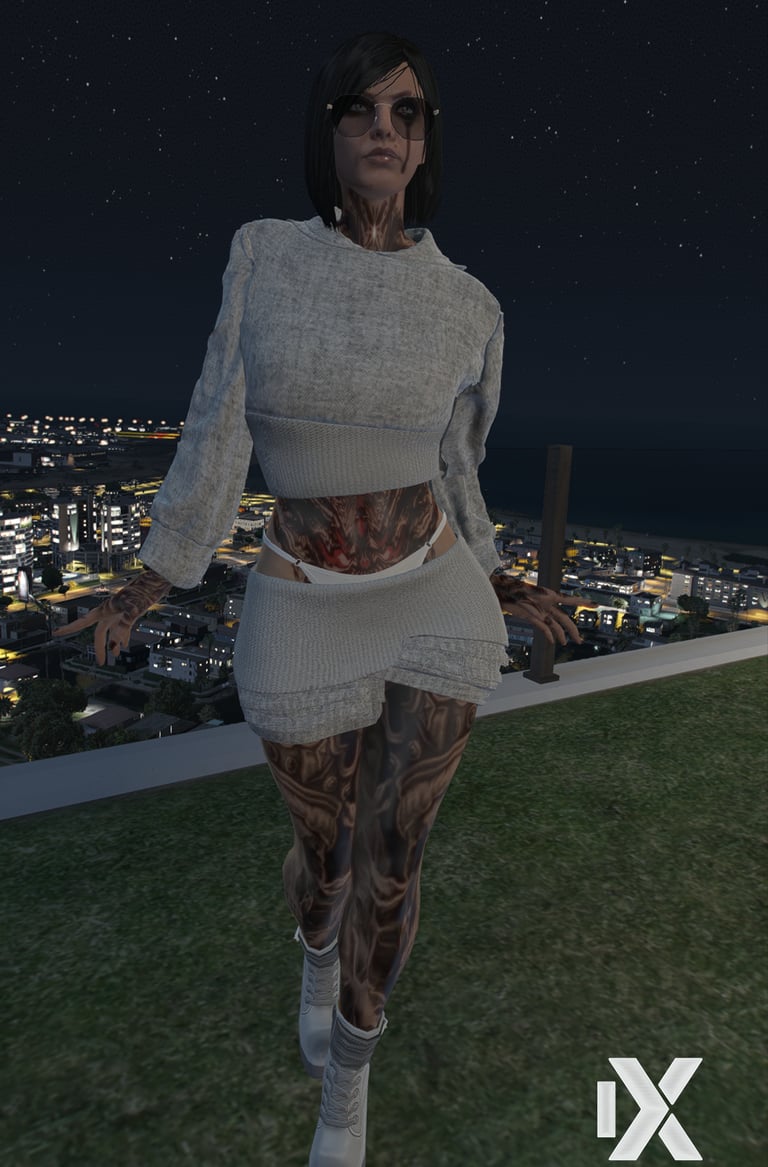 a woman in a white dress and sunglasses